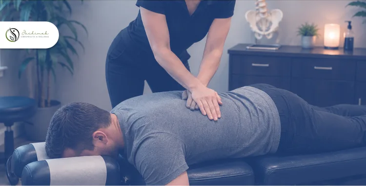 Chiropractor providing spinal adjustment therapy for long-term back pain relief and wellness