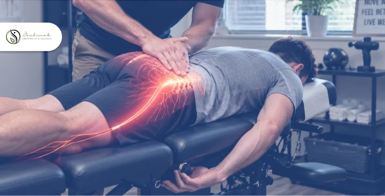 Chiropractor providing treatment for sciatic nerve pain and lower back discomfort